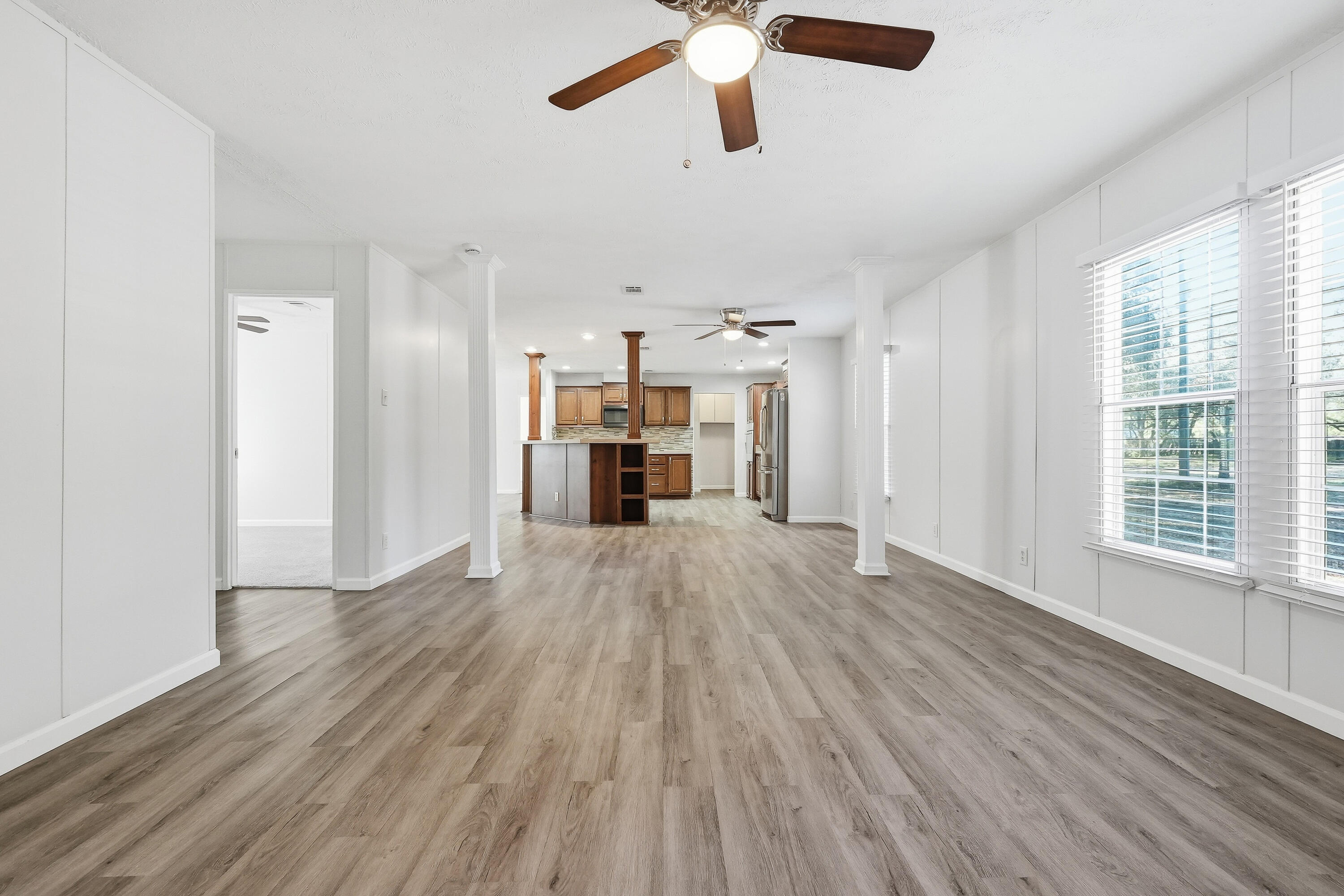 482 Roberts Road East DeFuniak Springs, FL 32433 - Photo 30 of 61 a view of empty room with wooden floor and window