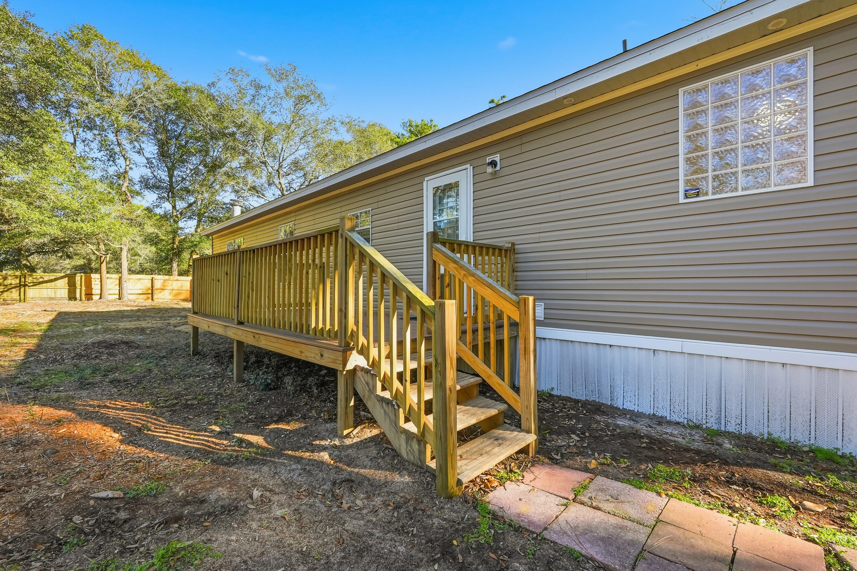 482 Roberts Road East DeFuniak Springs, FL 32433 - Photo 3 of 61 a view of a house with backyard and wooden fence