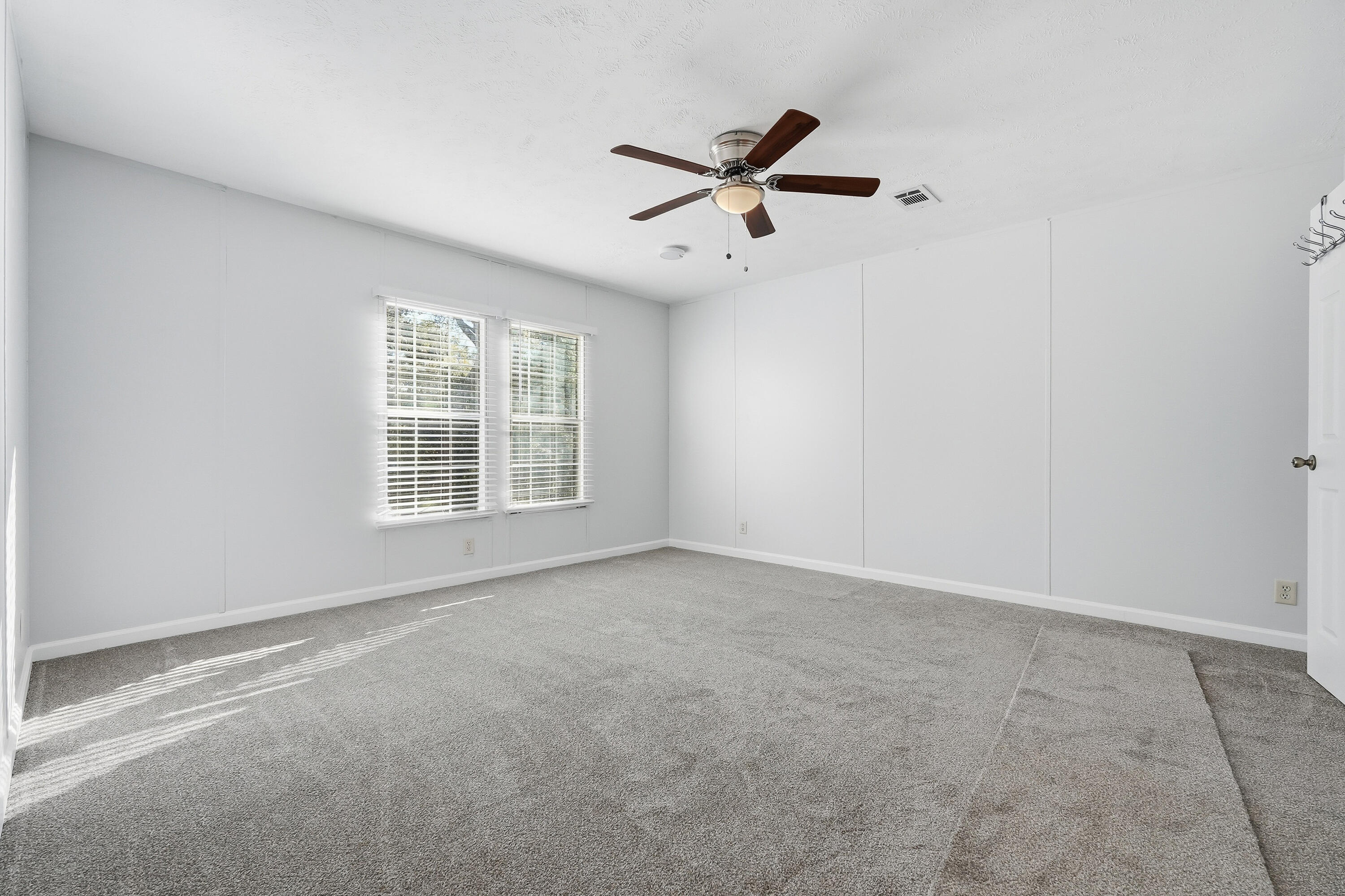 482 Roberts Road East DeFuniak Springs, FL 32433 - Photo 31 of 61 a view of a livingroom with a ceiling fan and window