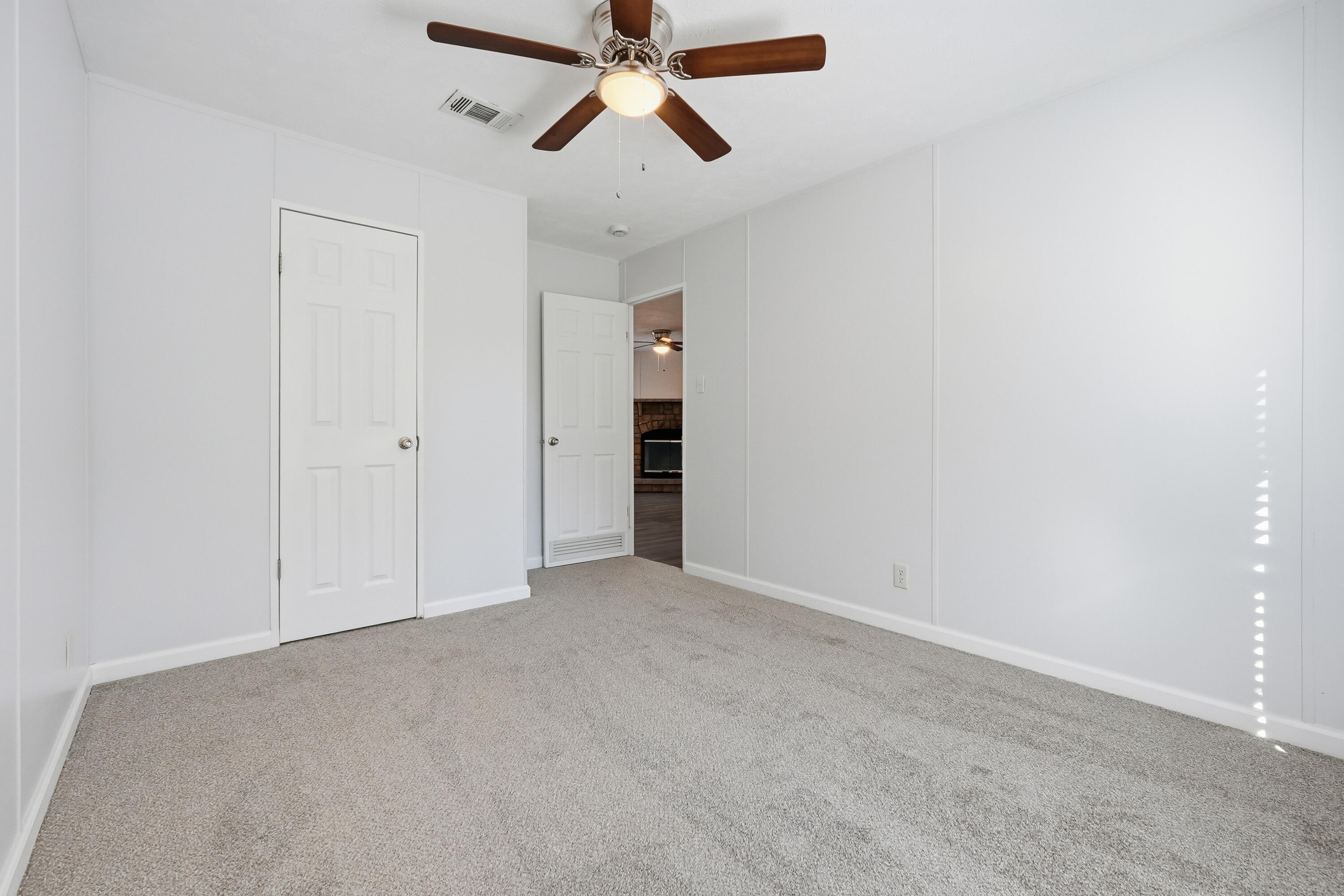 482 Roberts Road East DeFuniak Springs, FL 32433 - Photo 34 of 61 an empty room with chandelier fan