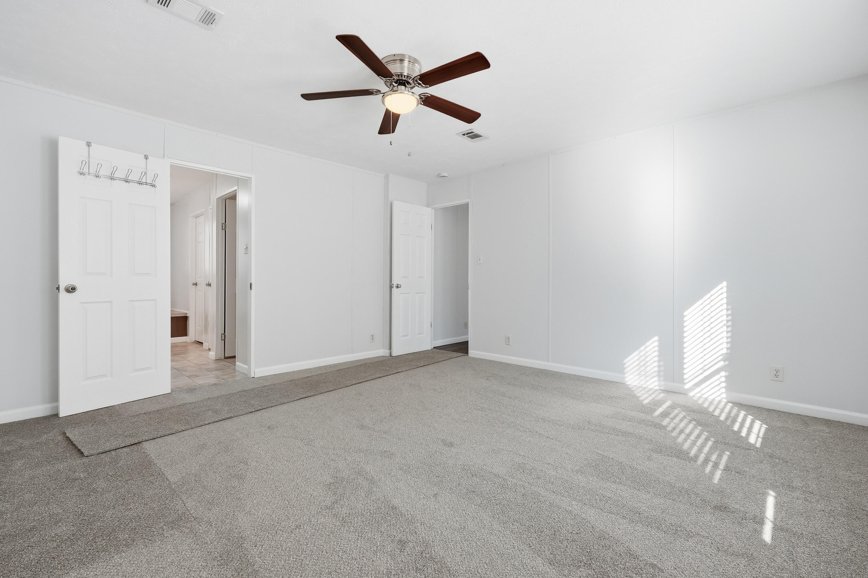 482 Roberts Road East DeFuniak Springs, FL 32433 - Photo 36 of 61 an empty room with closet and ceiling fan