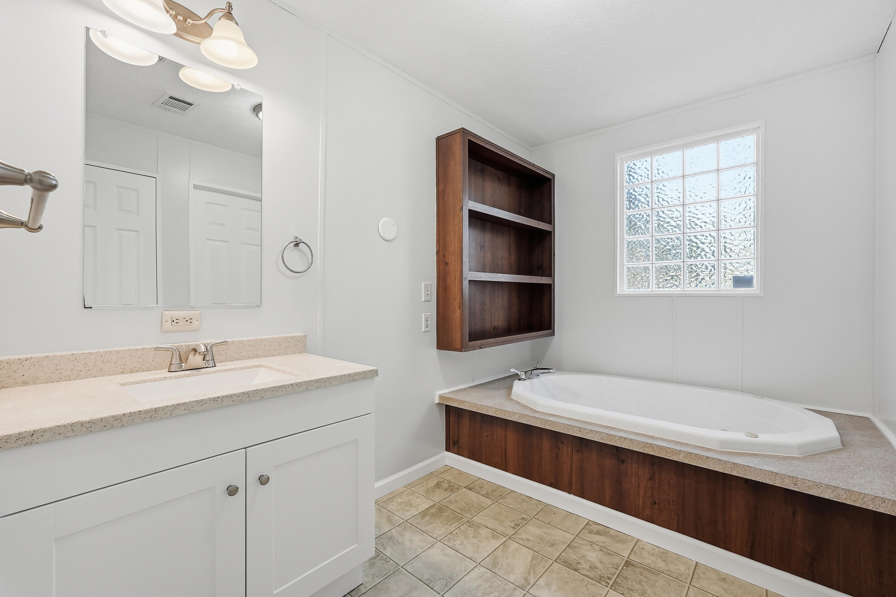 482 Roberts Road East DeFuniak Springs, FL 32433 - Photo 39 of 61 a bathroom with a sink a toilet and shower