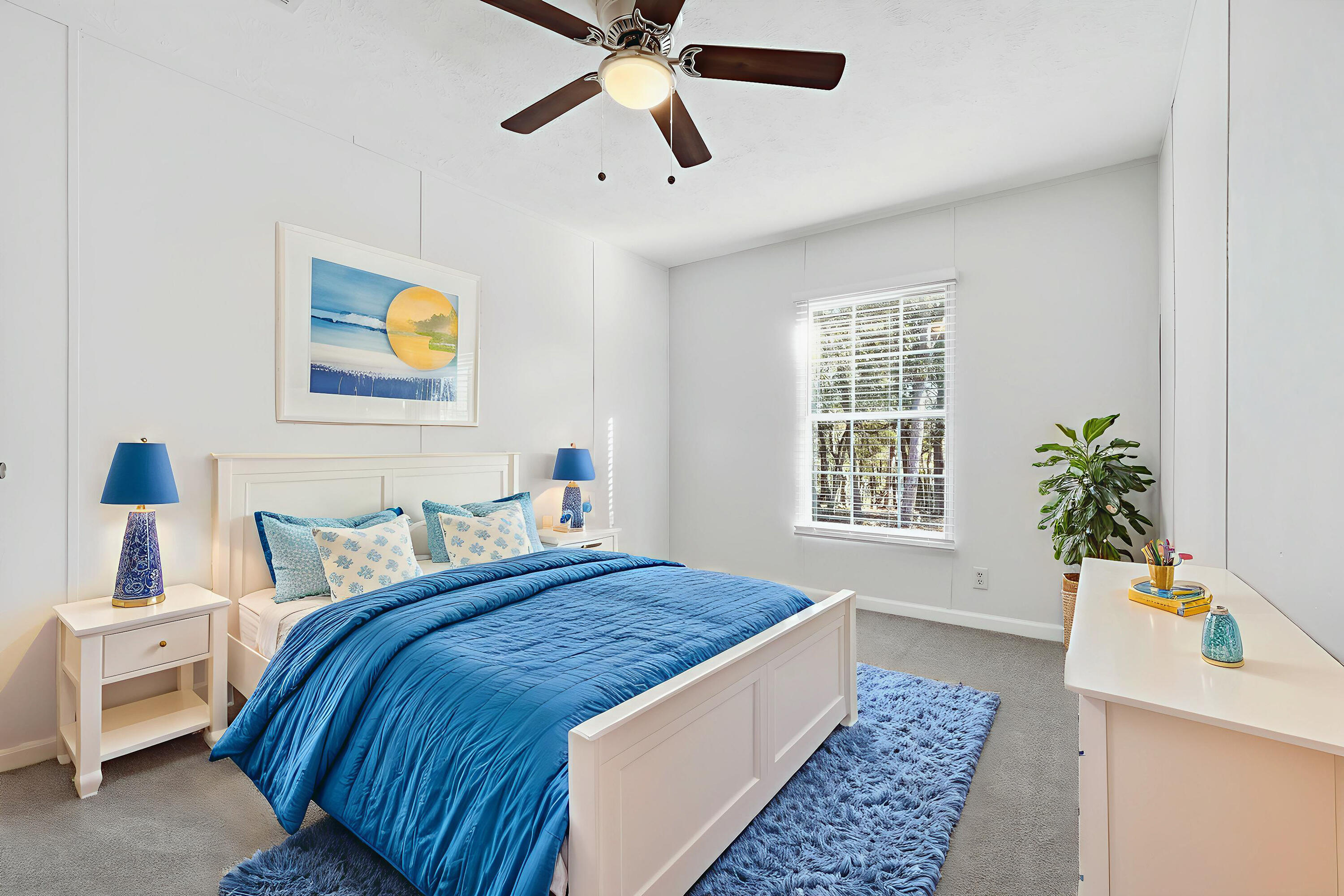 482 Roberts Road East DeFuniak Springs, FL 32433 - Photo 43 of 61 a bedroom with a bed and a potted plant