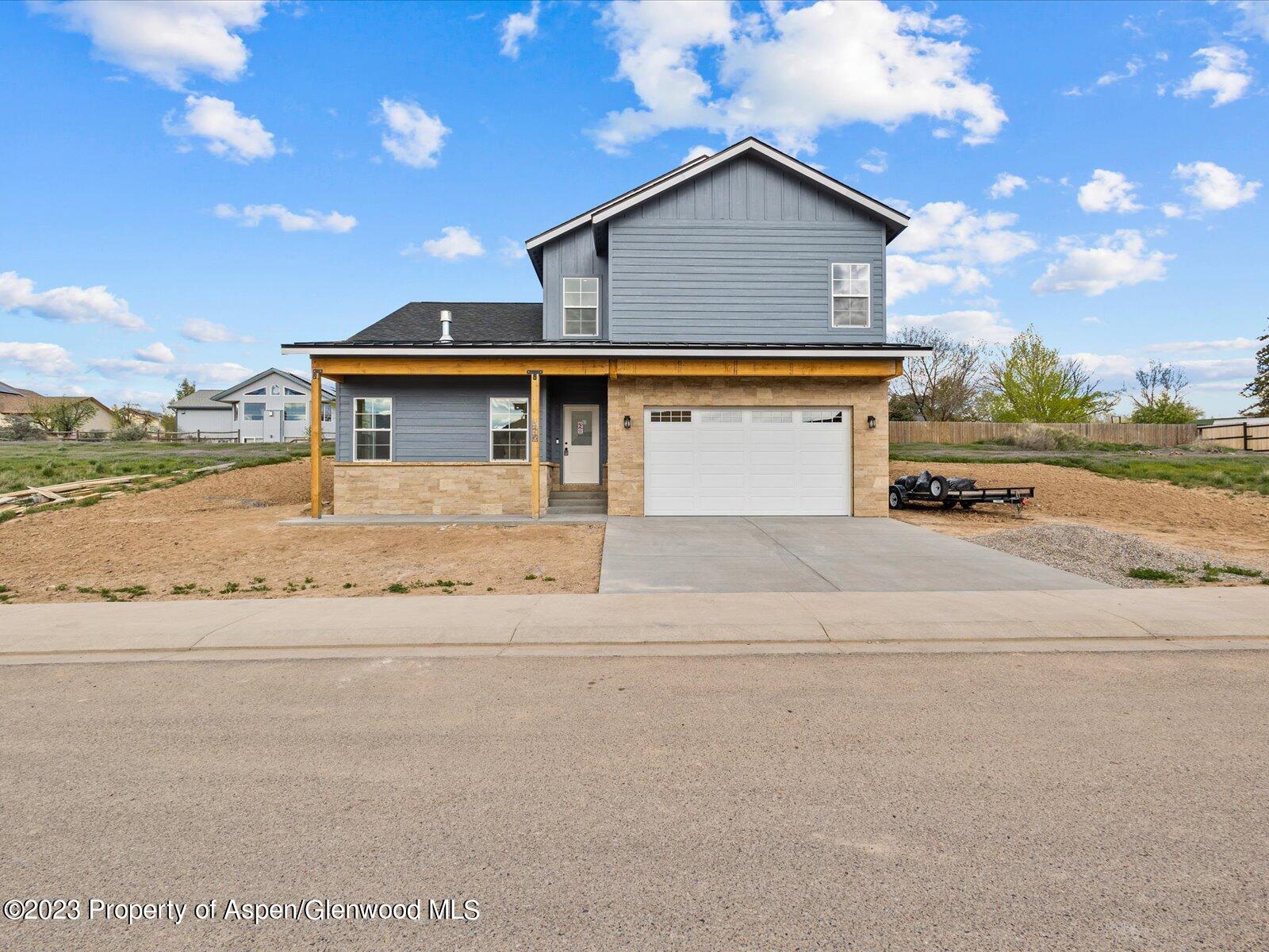 1416 Rifle Heights Drive Rifle, CO 81650 - Photo 2 of 35 front view of house with a street