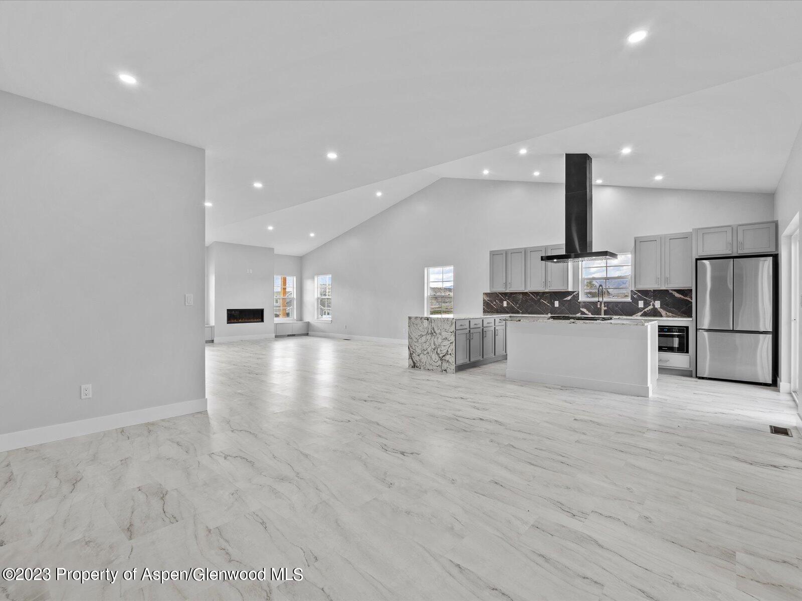 1416 Rifle Heights Drive Rifle, CO 81650 - Photo 22 of 35 a view of kitchen with wooden floor