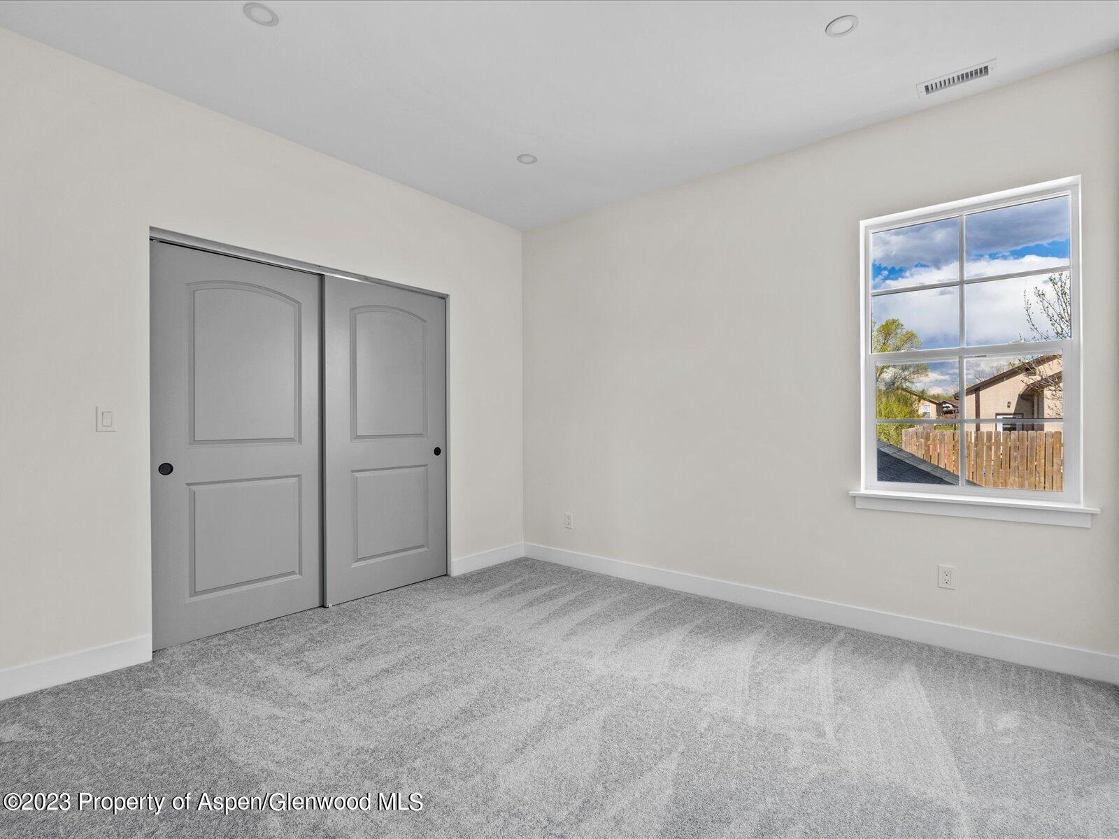 1416 Rifle Heights Drive Rifle, CO 81650 - Photo 27 of 35 a view of an empty room with a window