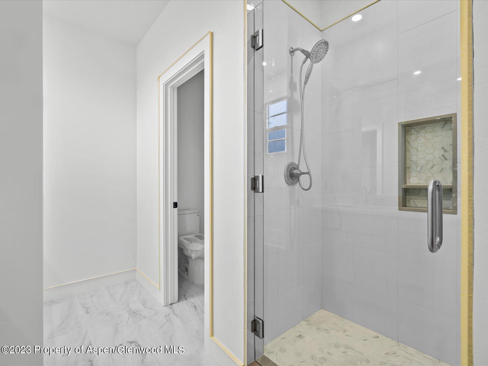 1416 Rifle Heights Drive Rifle, CO 81650 - Photo 33 of 35 a bathroom with a shower
