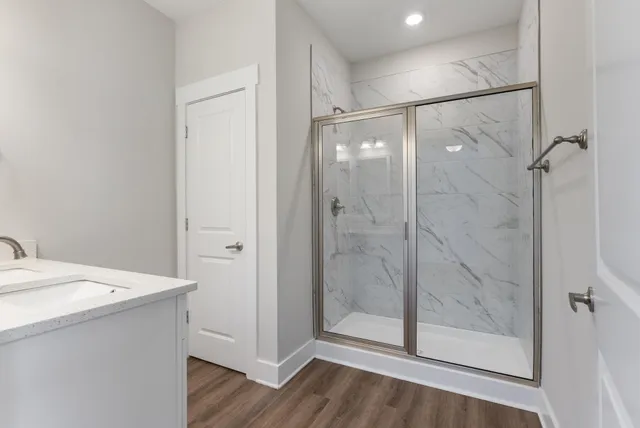 a bathroom with a shower and sink