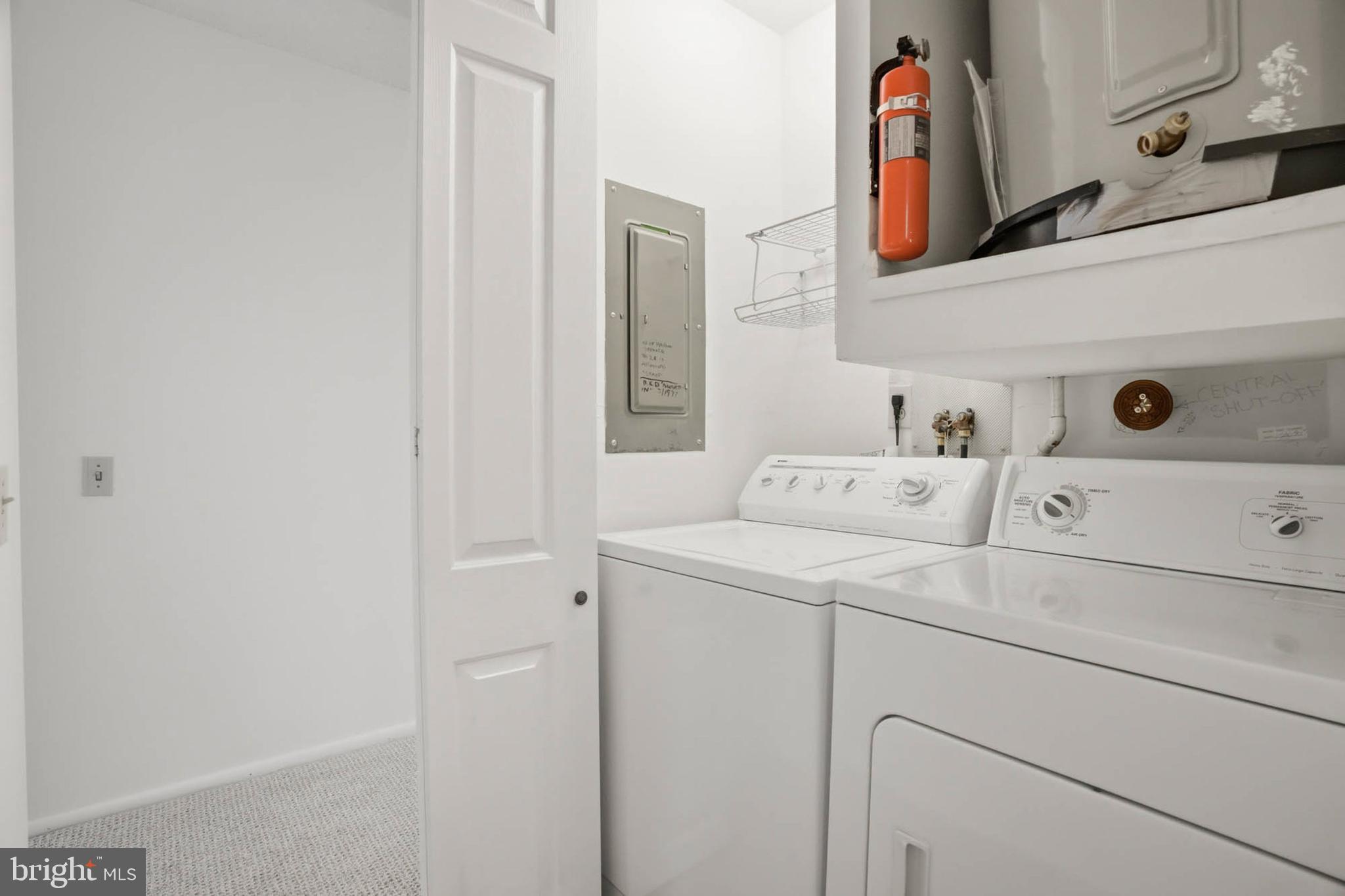 3501 Forest Edge Drive, Unit 142G Silver Spring, MD 20906 - Photo 14 of 30 a utility room with dryer and washer