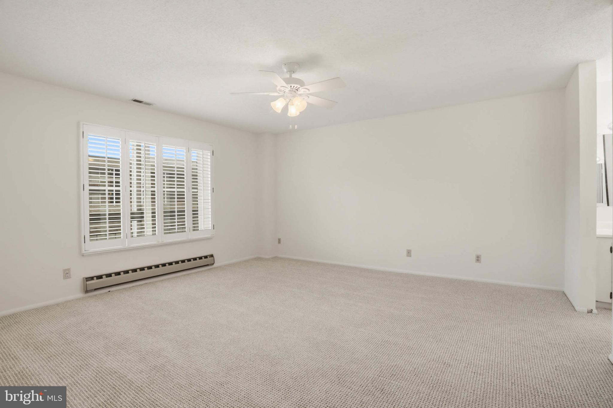 3501 Forest Edge Drive, Unit 142G Silver Spring, MD 20906 - Photo 15 of 30 an empty room with a window