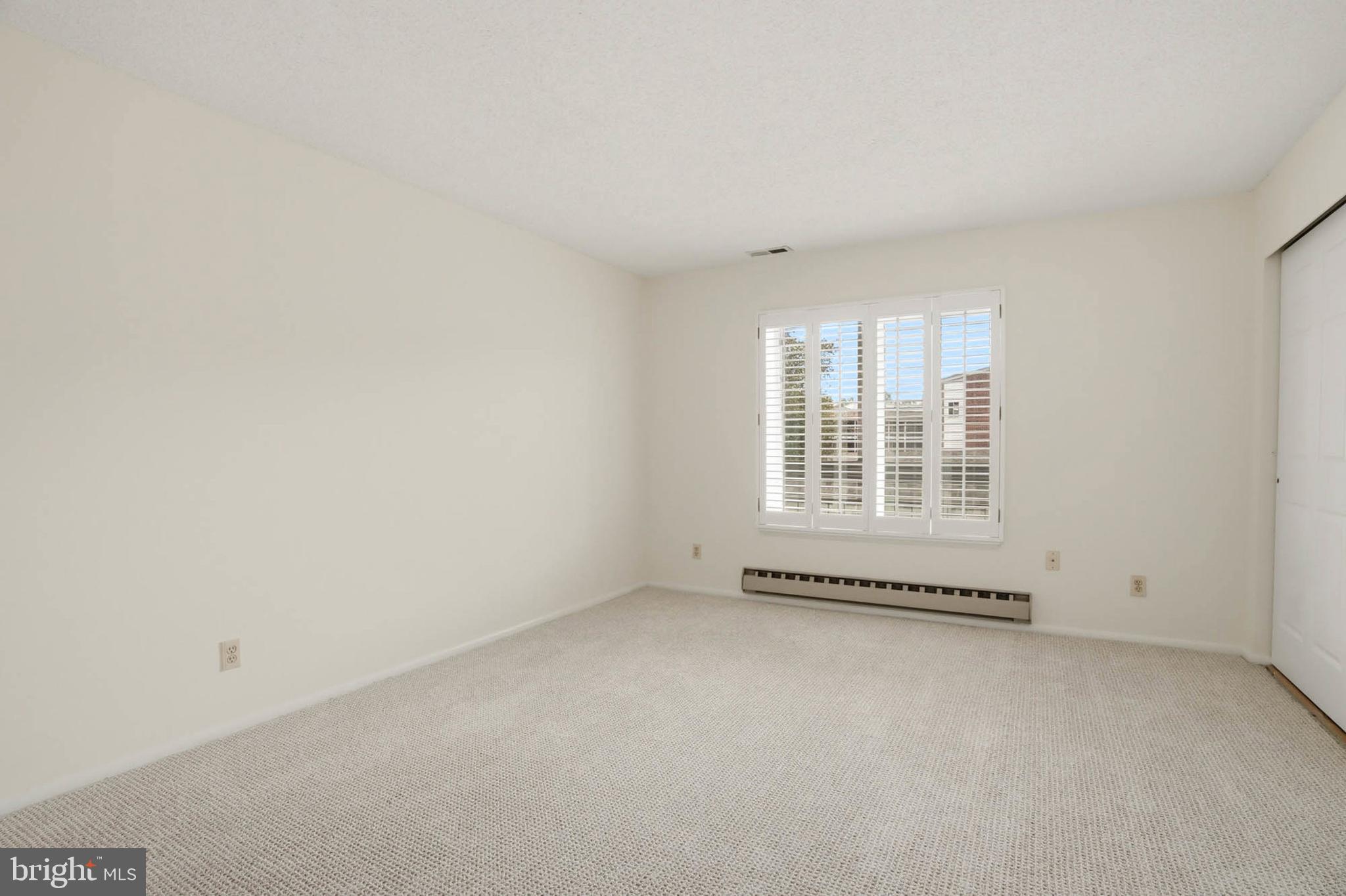 3501 Forest Edge Drive, Unit 142G Silver Spring, MD 20906 - Photo 19 of 30 an empty room with windows