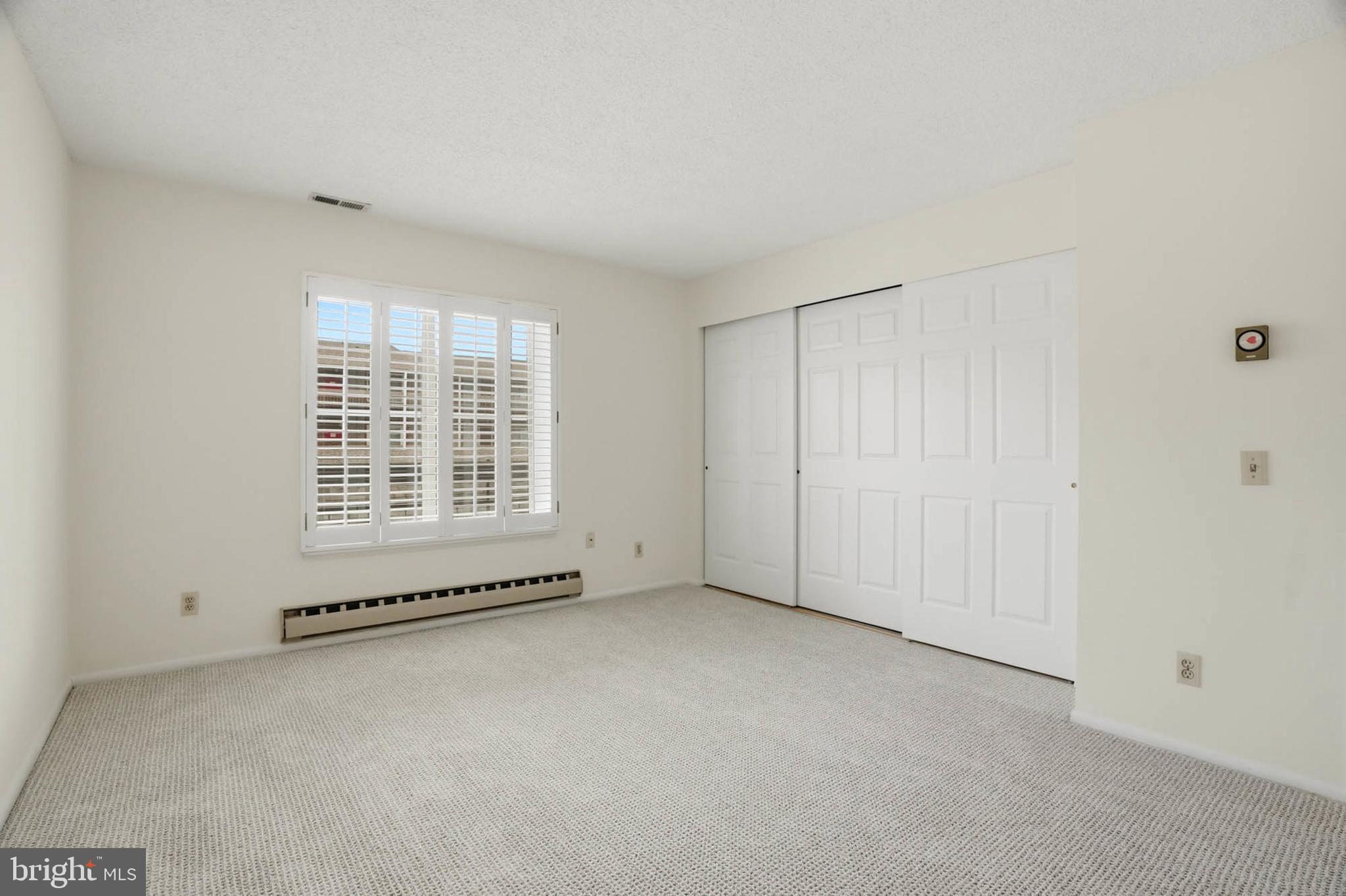 3501 Forest Edge Drive, Unit 142G Silver Spring, MD 20906 - Photo 20 of 30 a view of an empty room with a window