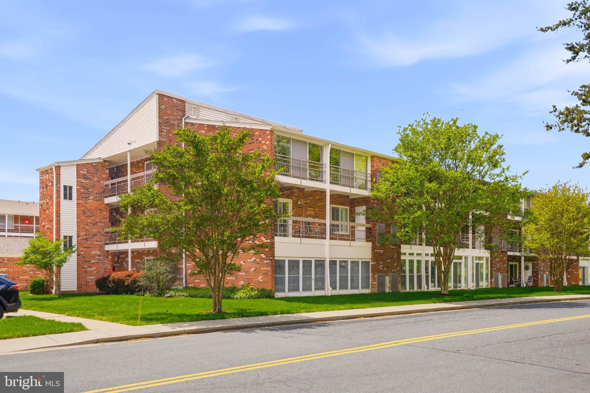 3501 Forest Edge Drive, Unit 142G Silver Spring, MD 20906 - Photo 2 of 30 a view of a residential apartment building in a yard