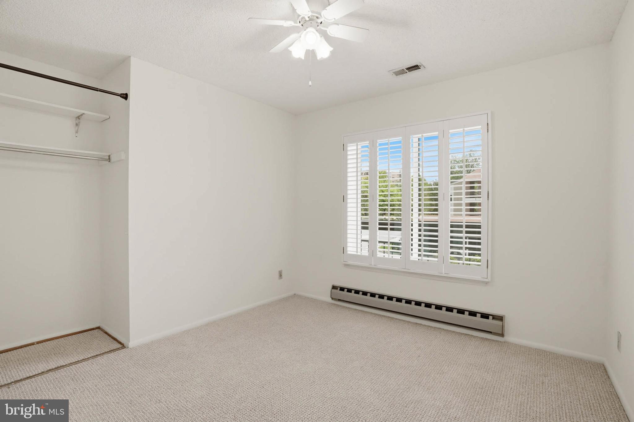 3501 Forest Edge Drive, Unit 142G Silver Spring, MD 20906 - Photo 23 of 30 a view of an empty room with a window