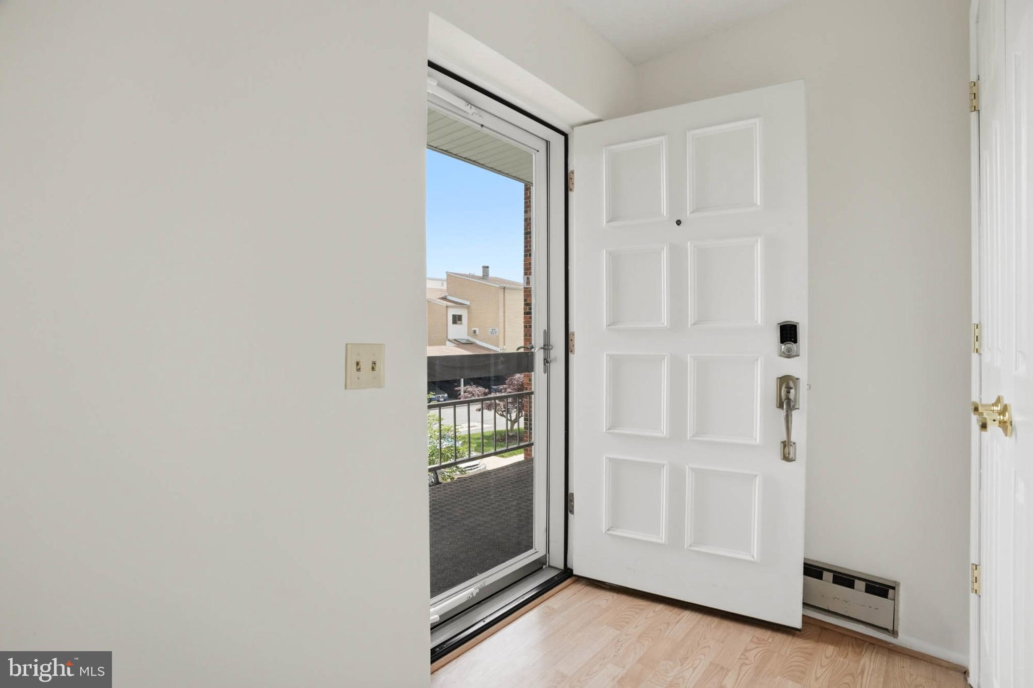 3501 Forest Edge Drive, Unit 142G Silver Spring, MD 20906 - Photo 3 of 30 a view of front door with wooden floor
