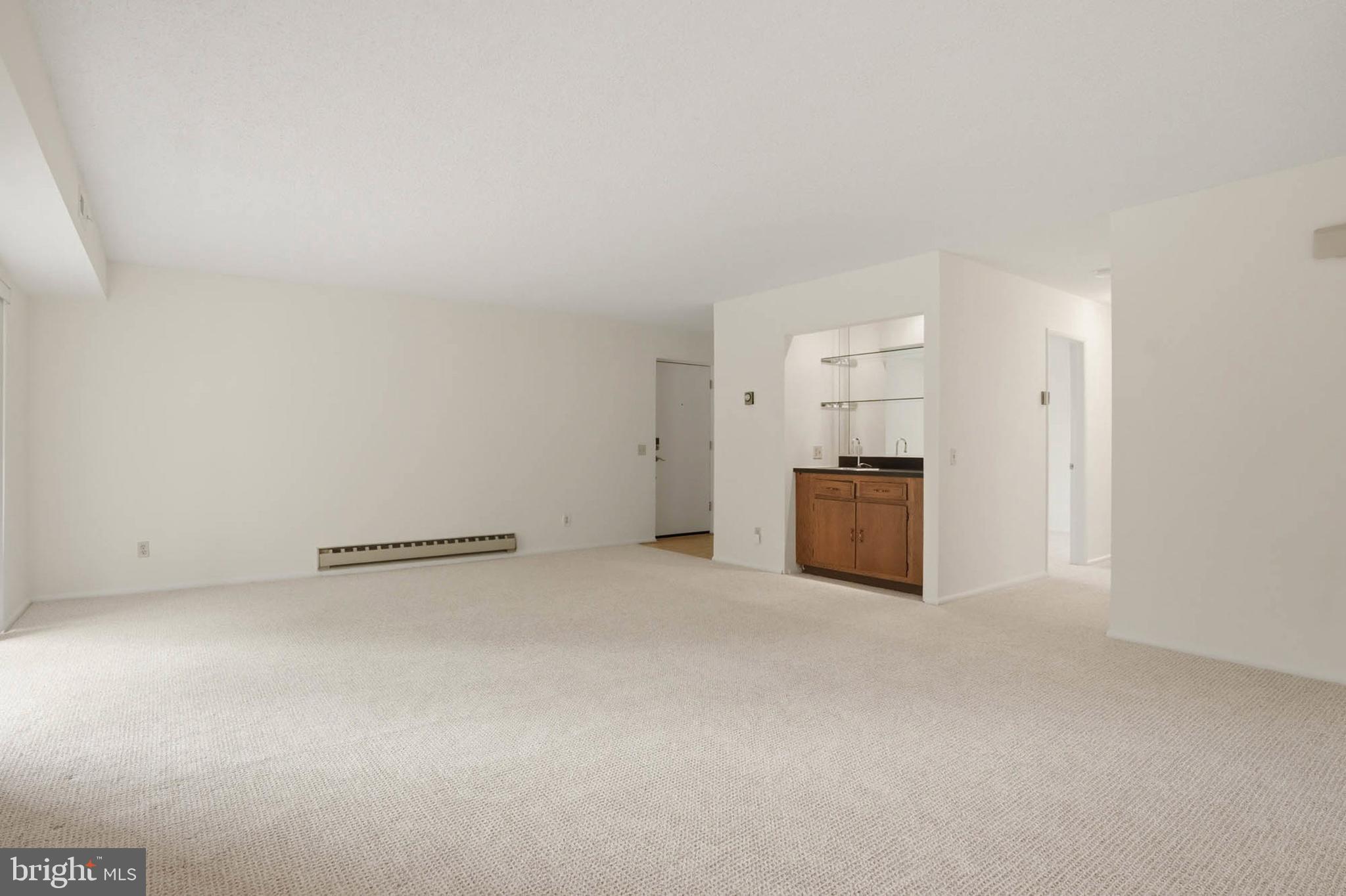 3501 Forest Edge Drive, Unit 142G Silver Spring, MD 20906 - Photo 6 of 30 a view of empty room with kitchen