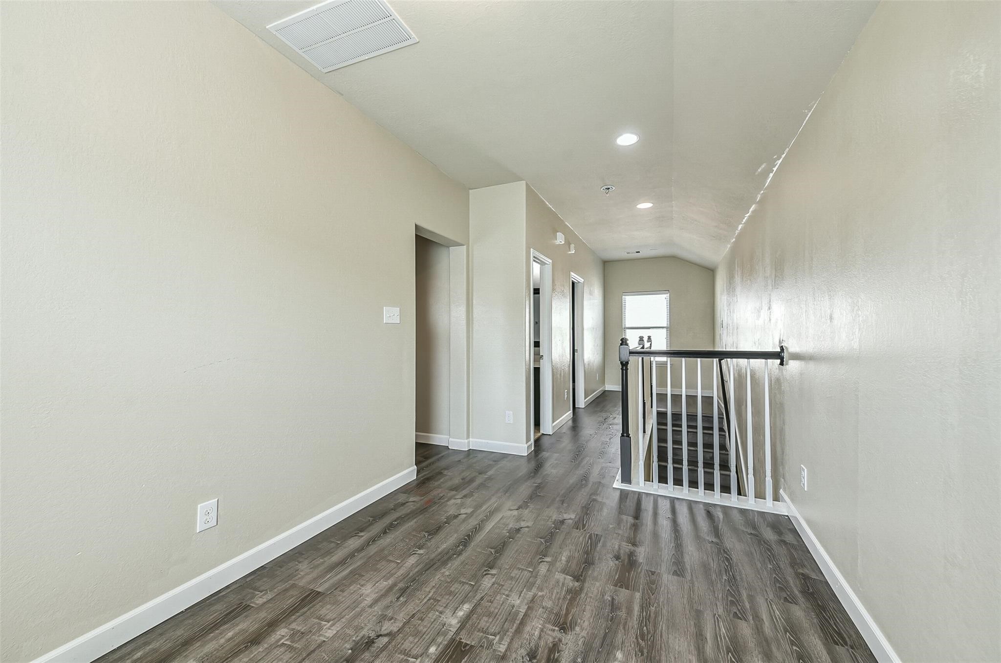 9111 Fuqua Ridge Lane Houston, TX 77075 - Photo 16 of 21 a view of a hallway with wooden floor