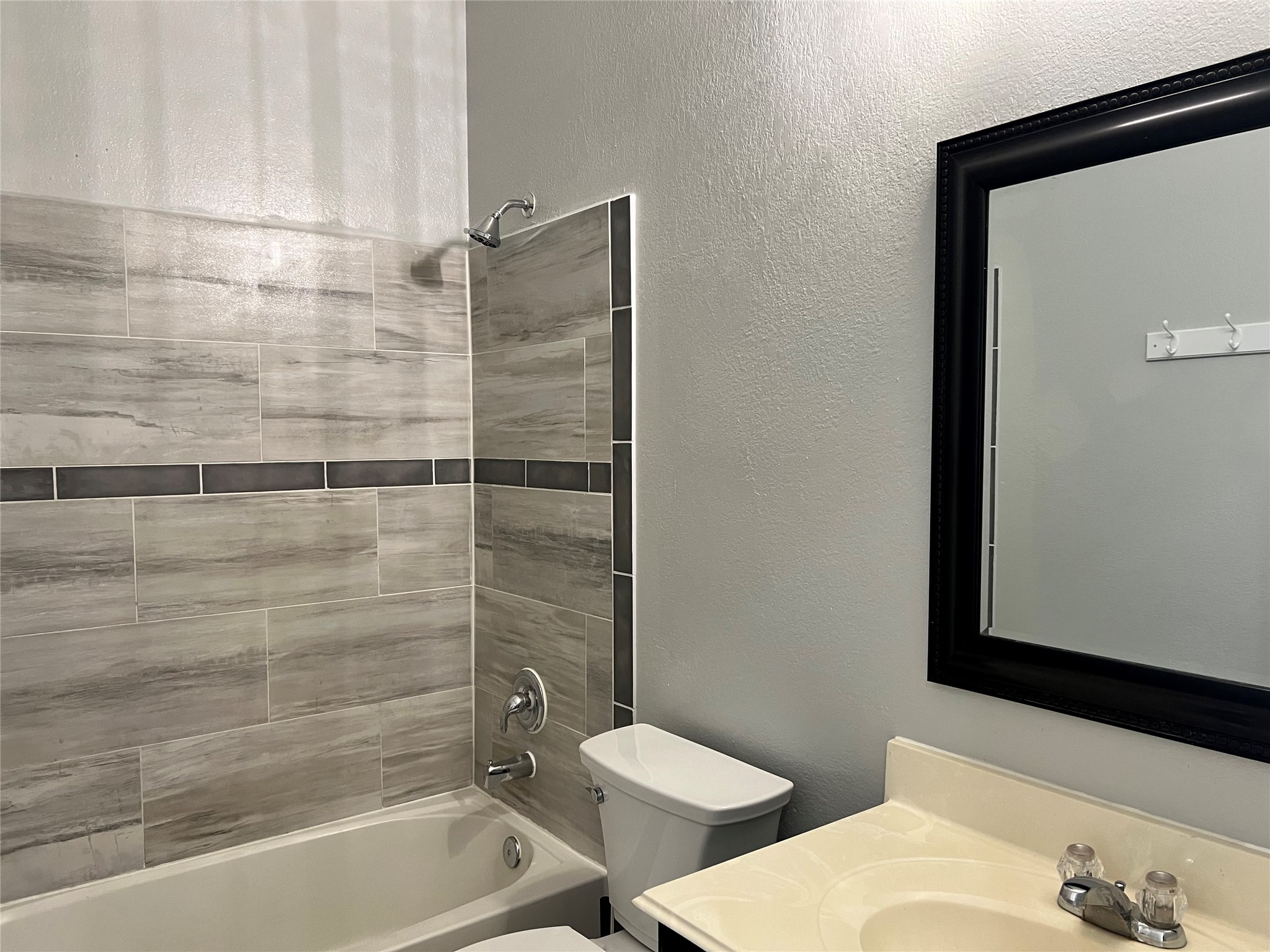 9111 Fuqua Ridge Lane Houston, TX 77075 - Photo 19 of 21 a bathroom with a bathtub and shower