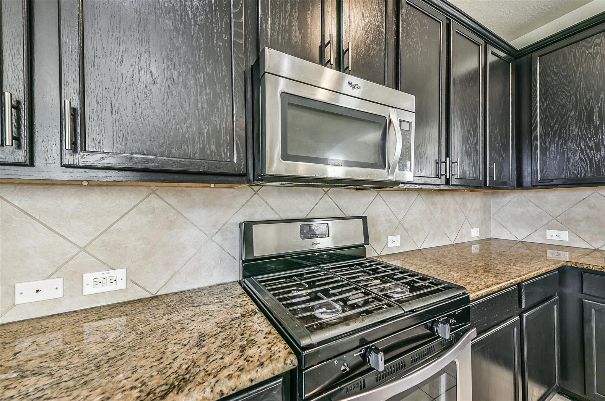 9111 Fuqua Ridge Lane Houston, TX 77075 - Photo 7 of 21 a stove top oven sitting inside of a kitchen