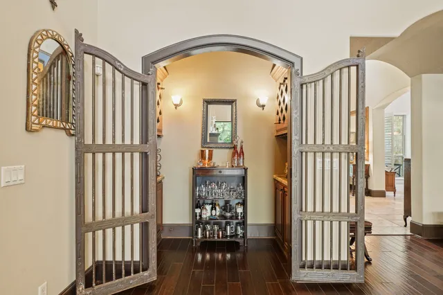 a living room with furniture a table and chairs