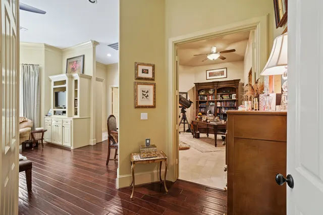 a view of a balcony with wooden floor and fence
