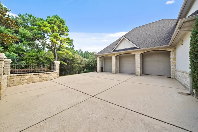 a living room with furniture a large mirror and a table
