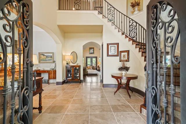 a living room with furniture a rug and a fireplace