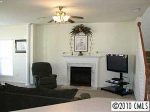 5931 Summer Fog End Fort Mill, SC 29708 - Photo 4 of 8 a living room with furniture and a fireplace