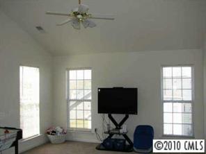 5931 Summer Fog End Fort Mill, SC 29708 - Photo 7 of 8 a living room with furniture a flat screen tv and a window