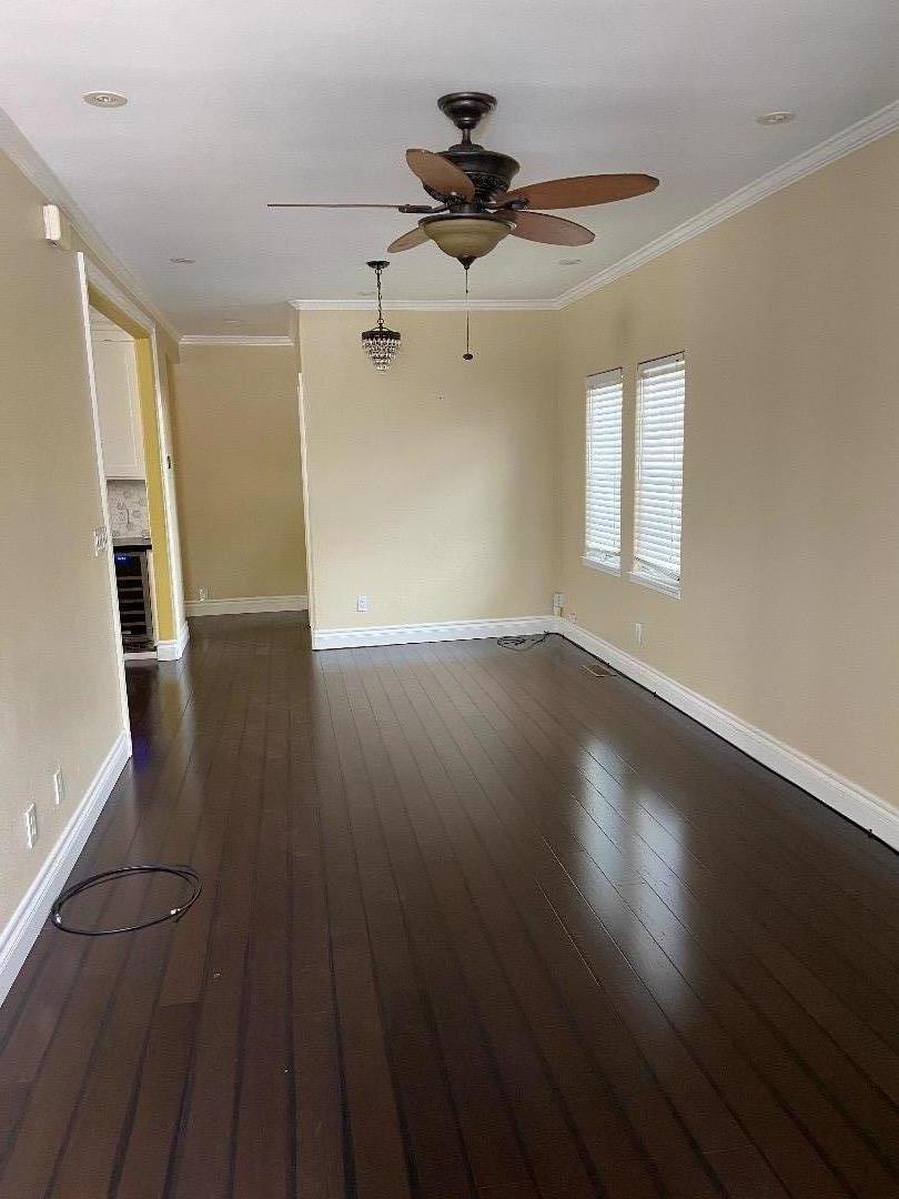348 Garretson Avenue Rodeo, CA 94572 - Photo 2 of 9 a view of an empty room with wooden floor and a window