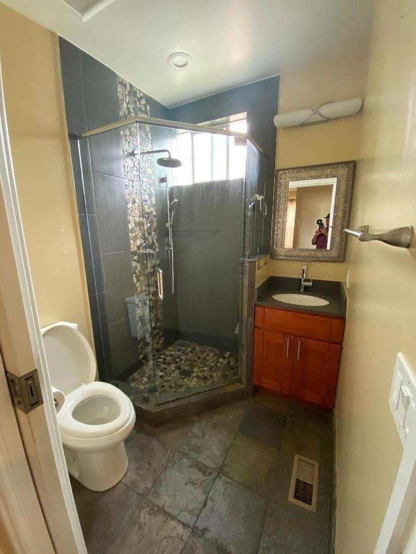 348 Garretson Avenue Rodeo, CA 94572 - Photo 4 of 9 a bathroom with a toilet and a shower