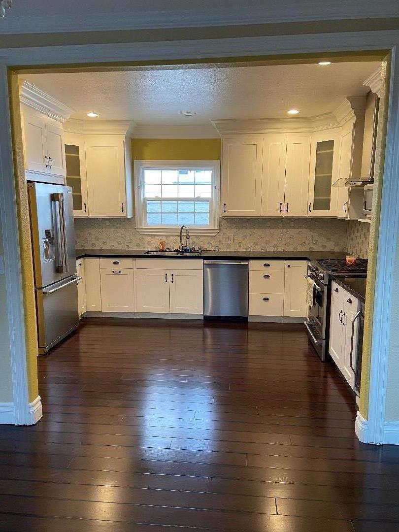 348 Garretson Avenue Rodeo, CA 94572 - Photo 6 of 9 a large kitchen with cabinets and wooden floor