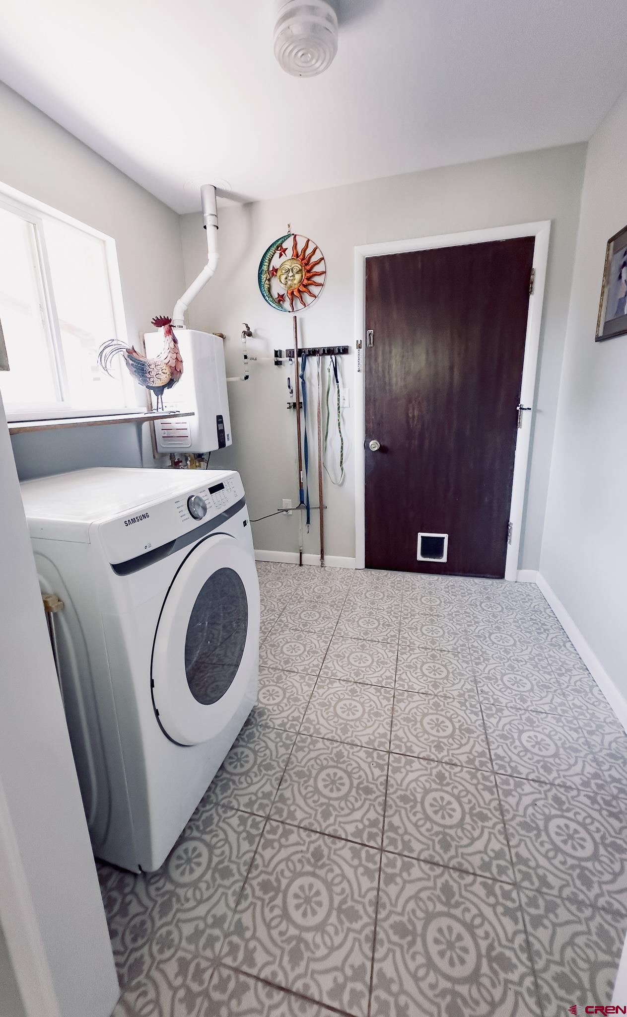 706 South Cedar Street Cortez, CO 81321 - Photo 16 of 36 a utility room with dryer and washer