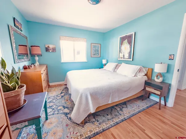 a bed room with a bed and a window