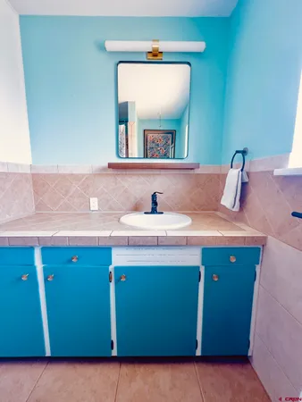 a bathroom with a toilet and a sink