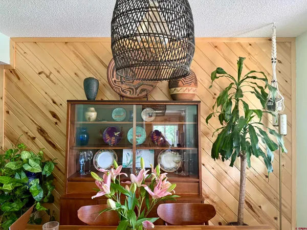 a vase of flowers sitting on a table