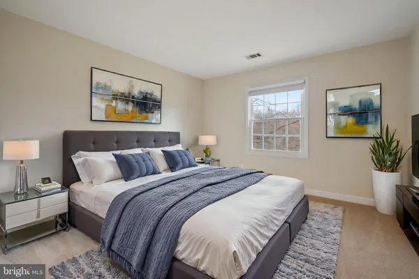 a view of swimming pool with a yard and trees in the background