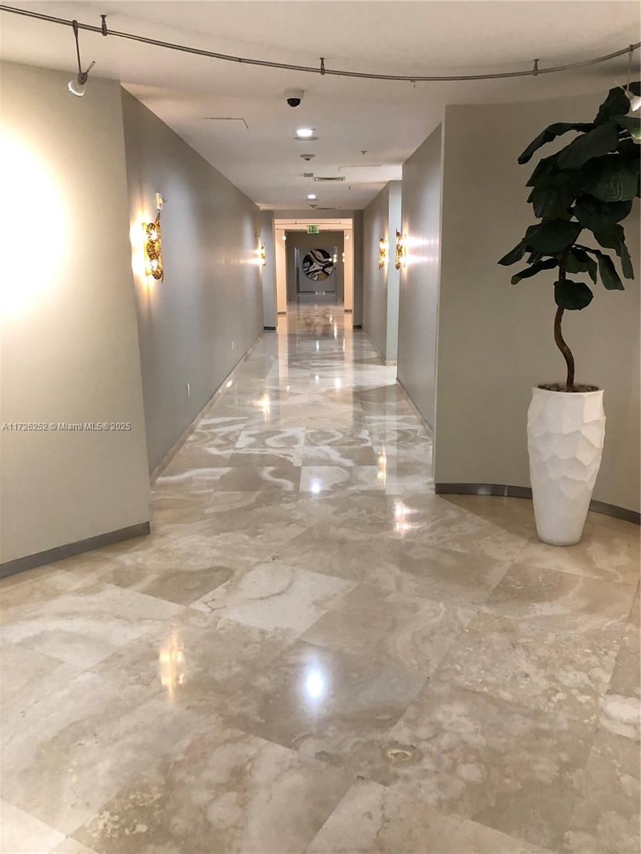 10275 Collins Avenue, Unit 1534 Bal Harbour, FL 33154 - Photo 28 of 33 hallway to gym