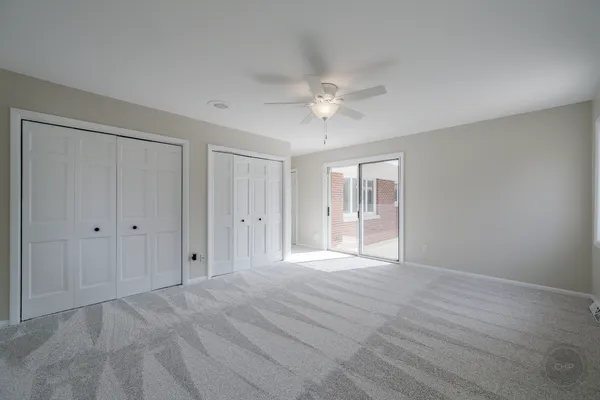 an empty room with closet area
