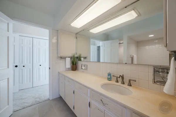 a bathroom with a toilet a sink and shower