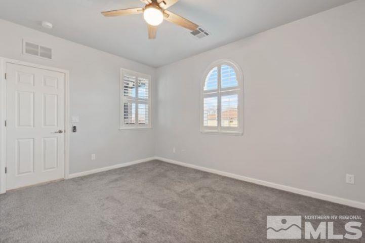 1700 Wind Ranch Road, Unit C Reno, NV 89521 - Photo 12 of 19 an empty room with windows and fan
