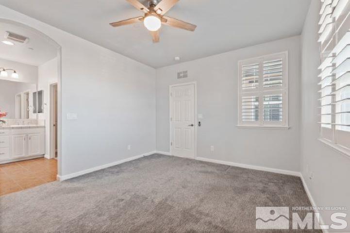 1700 Wind Ranch Road, Unit C Reno, NV 89521 - Photo 13 of 19 a view of an empty room with a window