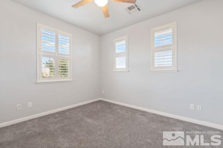1700 Wind Ranch Road, Unit C Reno, NV 89521 - Photo 16 of 19 an empty room with windows