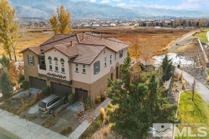 1700 Wind Ranch Road, Unit C Reno, NV 89521 - Photo 3 of 19 an aerial view of a house with a ocean view
