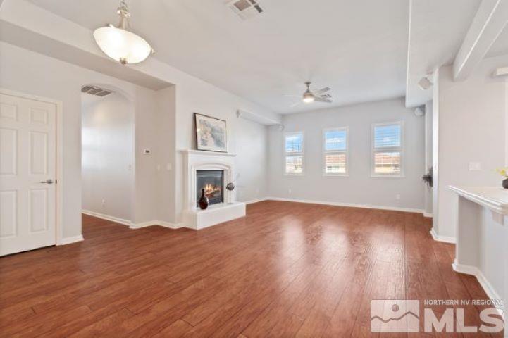 1700 Wind Ranch Road, Unit C Reno, NV 89521 - Photo 6 of 19 a view of empty room with wooden floor and fan