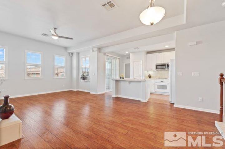 1700 Wind Ranch Road, Unit C Reno, NV 89521 - Photo 7 of 19 a view of kitchen and hall with wooden floor