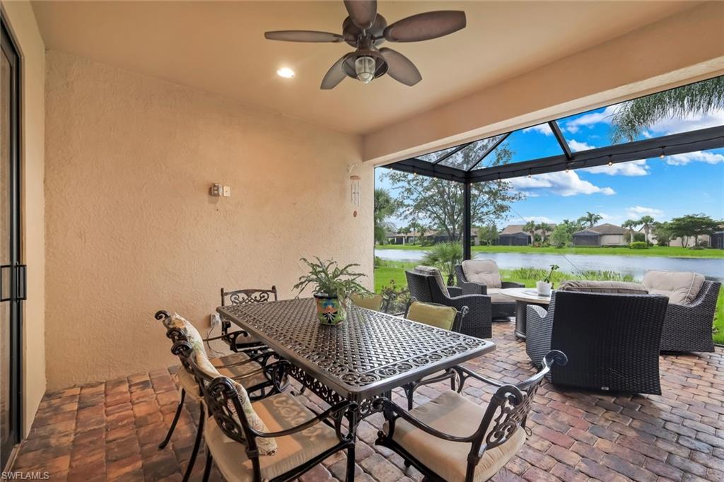 10820 Rutherford Road Fort Myers, FL 33913 - Photo 20 of 42 Screened patio with brick paver flooring, overhead ceiling fan, recessed lighting, and water frontage