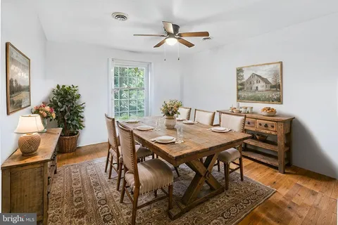 a view of a dining room with furniture and window