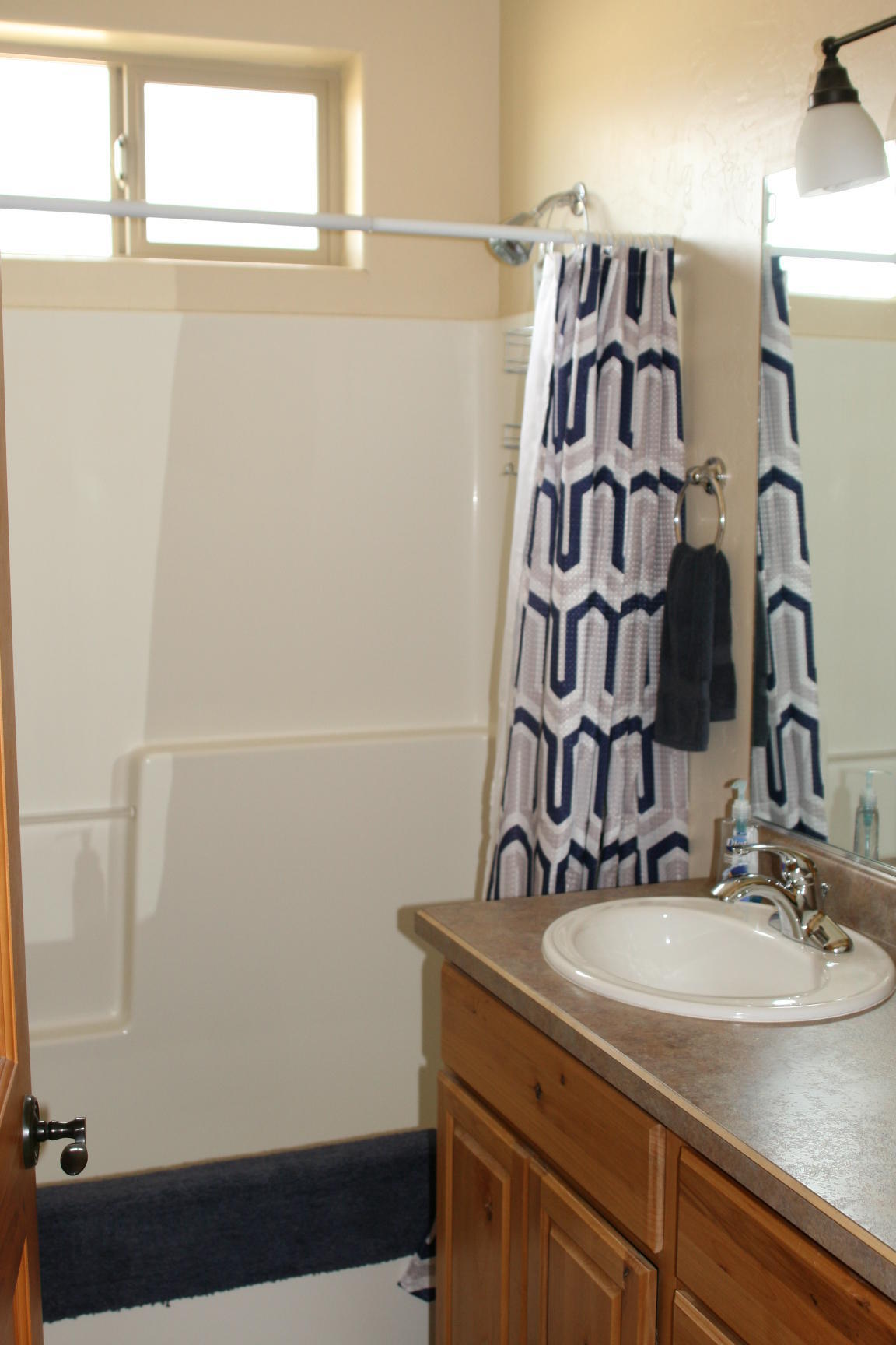 407 Kismet Street, Unit NO # Ridgway, CO 81432 - Photo 19 of 34 a bathroom with a sink and a mirror