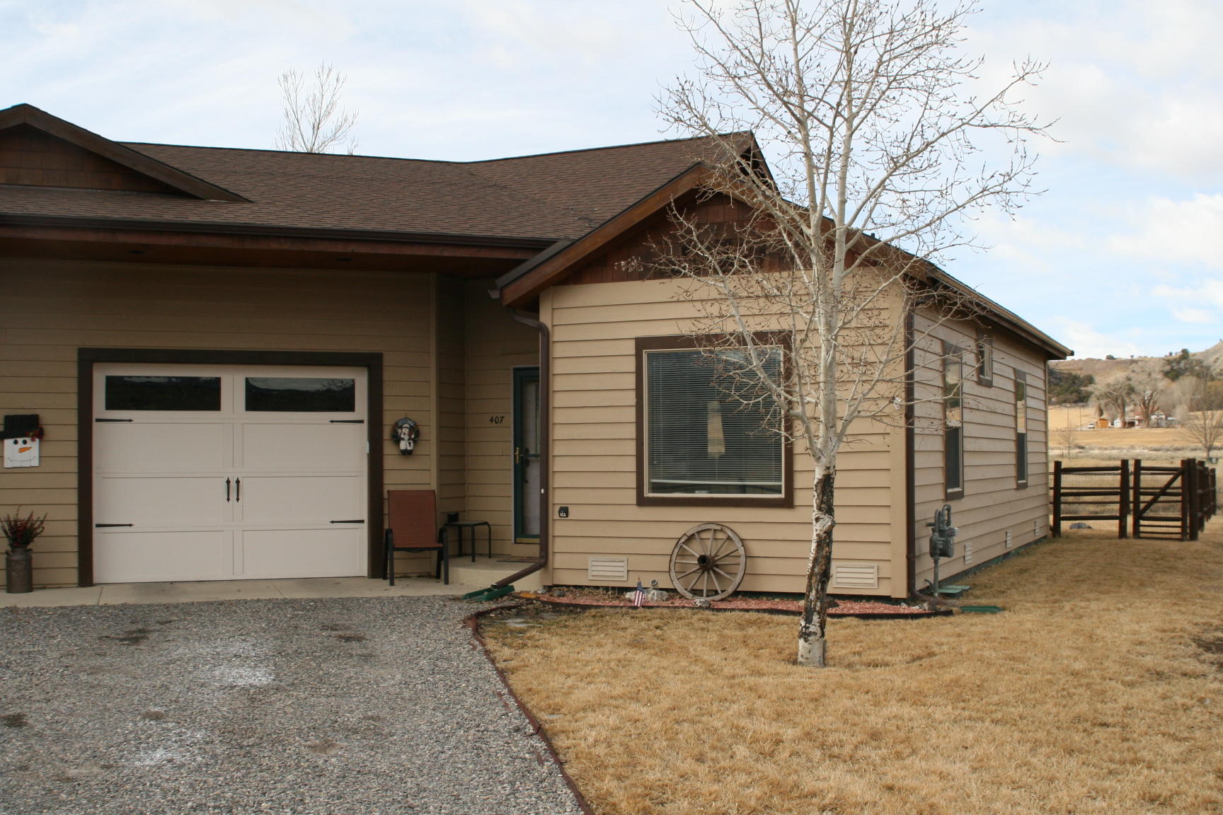 407 Kismet Street, Unit NO # Ridgway, CO 81432 - Photo 2 of 34 a front view of a house with a yard